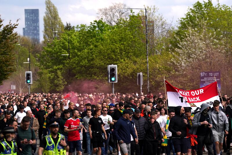 Manchester United fans take part in a protest against the team's ownership. PA