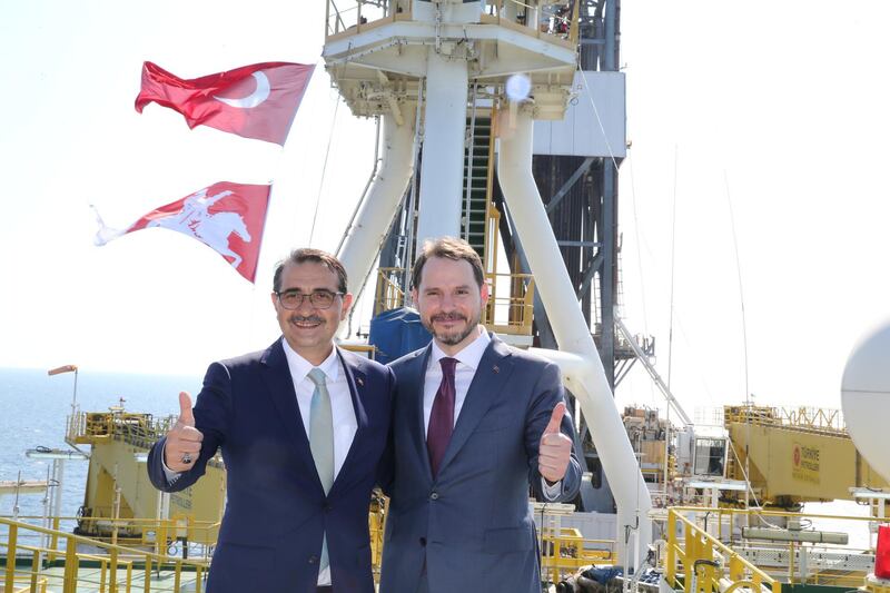 Turkish Finance Minister Berat Albayrak and Energy Minister Fatih Donmez pose on the deck of drilling vessel 'Fatih' in the western Black Sea, off Turkey. Reuters