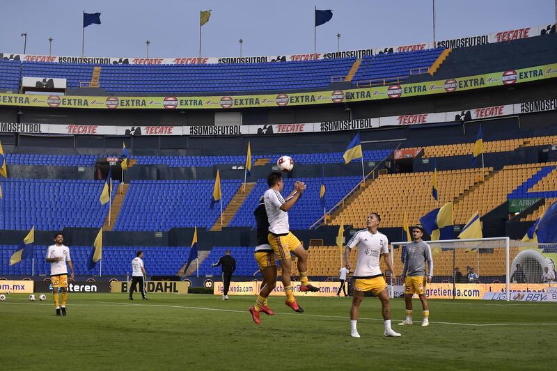 Players of Tigres warm up in an empty stadium prior to the 10th round match between Tigres UANL and FC Juarez as part of the Torneo Clausura 2020 Liga MX at Universitario Stadium in Monterrey, Mexico. Getty Images