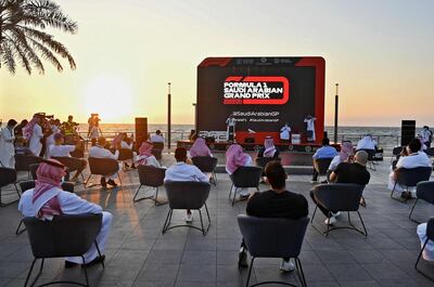 People attend a press conference to announce Saudi Arabian Grand Prix as part of the 2021 F1 calendar, in the Red Sea coastal city of Jeddah on November 5, 2020. Saudi Arabia said it will host a Formula One Grand Prix for the first time next year, with a night race in the Red Sea city of Jeddah. Saudi Arabia had been pencilled in for the 2021 season as part of a record 23-race Formula One programme, as the sport seeks to bounce back from a shortened 2020 season that has been disrupted by the coronavirus pandemic.  / AFP / Amer HILABI
