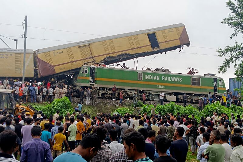 The crash caused two of the passenger train's carriages to derail near New Jalpaiguri station, in West Bengal state. AP