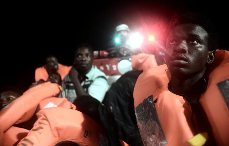 Migrants are rescued by staff members of the MV Aquarius, a search and rescue ship run in partnership between SOS Mediterranee and Medecins Sans Frontieres in the central Mediterranean Sea, June 9, 2018. Picture taken June 9, 2018. Karpov/handout via REUTERS ATTENTION EDITORS - THIS IMAGE WAS PROVIDED BY A THIRD PARTY. NO RESALES. NO ARCHIVES.