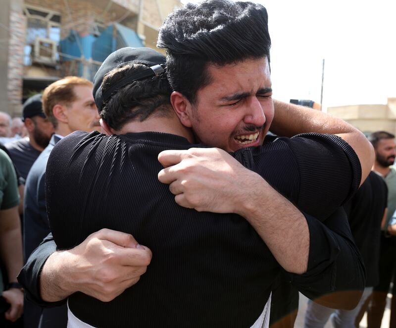 Iraqis mourn a victim killed in an alleged Turkish bombing in Dohuk city. EPA