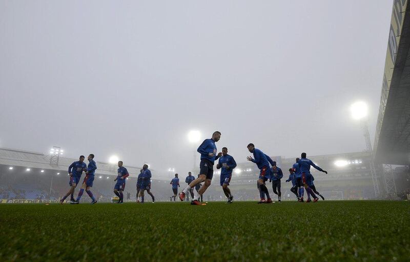 Crystal Palace players warm up before the match. Hannah McKay / EPA