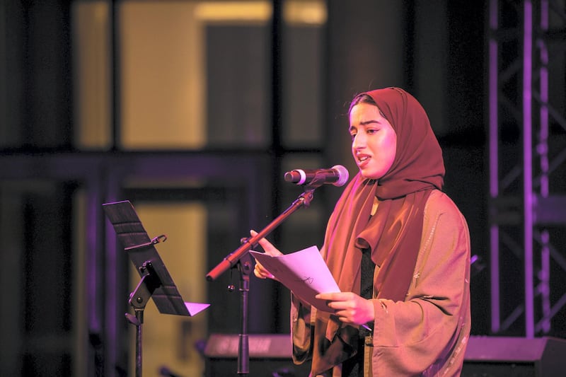Maitha AlSuwaidi, a student at NYUAD, read a long poem that made the connection between family roots and our sense of “home". Courtesy Nikith Nath