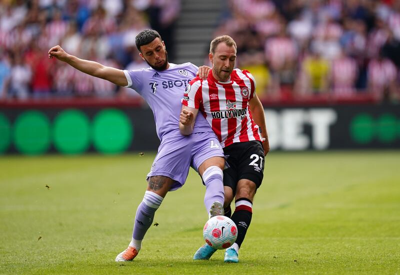 Leeds United's Sam Greenwood and Brentford's Christian Eriksen battle for the ball. PA