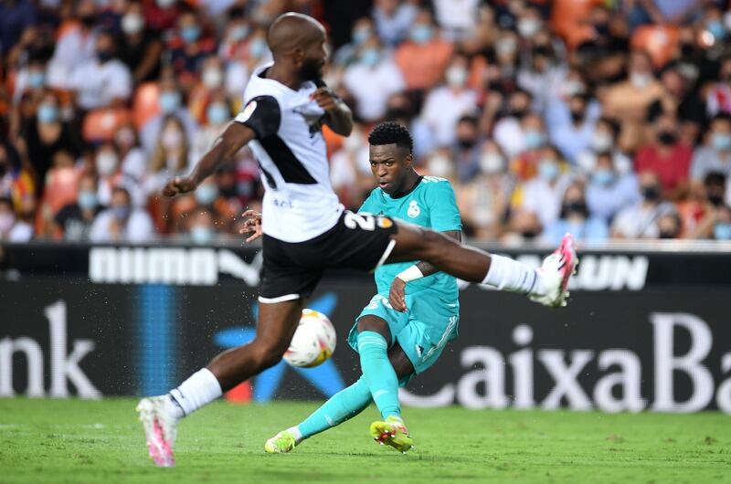 Vinicius Junior shoots to score Real Madrid's equaliser against Valencia. Getty Images