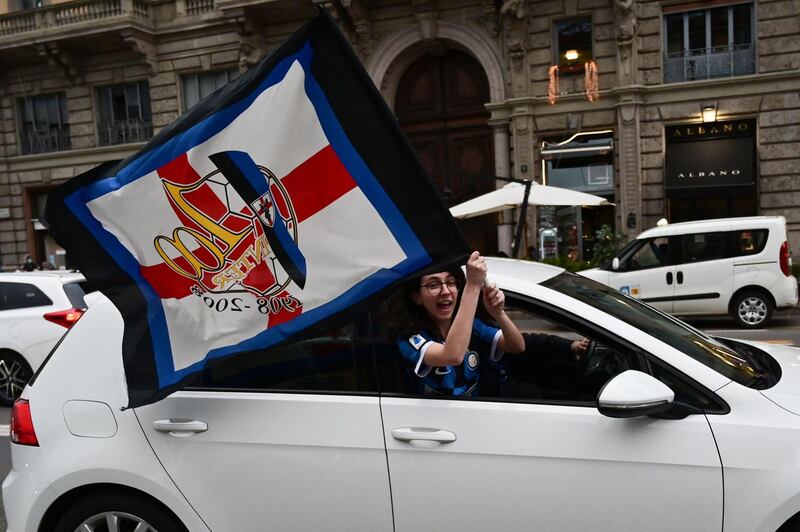 An Internazionale supporter waves a flag in Milan. AFP