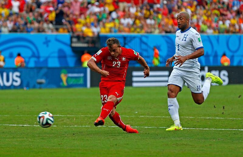 Xherdan Shaqiri of Switzerland shoots and scores his team's second goal against Honduras on Wednesday at the 2014 World Cup in Manaus, Brazil. Matthew Lewis / Getty Images
