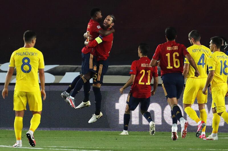 Sergio Ramos celebrates with  Ansu Fati (L) after scoring the opening goal for Spain against Ukraine. EPA