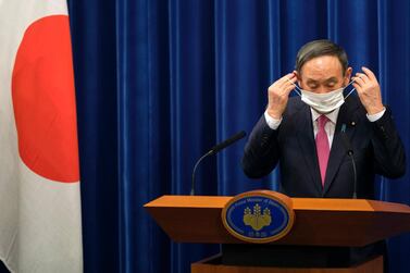 Japan's Prime Minister Yoshihide Suga is under pressure for a variety of reasons. AP Photo