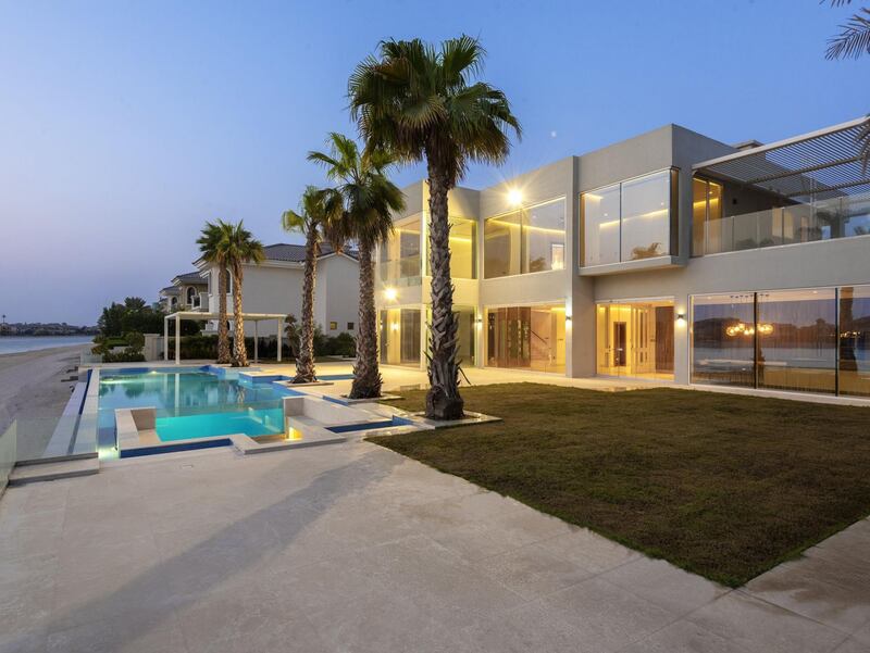 A Palm Jumeirah villa featuring an infinity pool