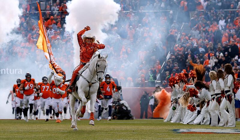 Ann Judge rides Thunder out ahead of the Denver Broncos before the game against the Los Angeles Chargers at Empower Field. Reuters
