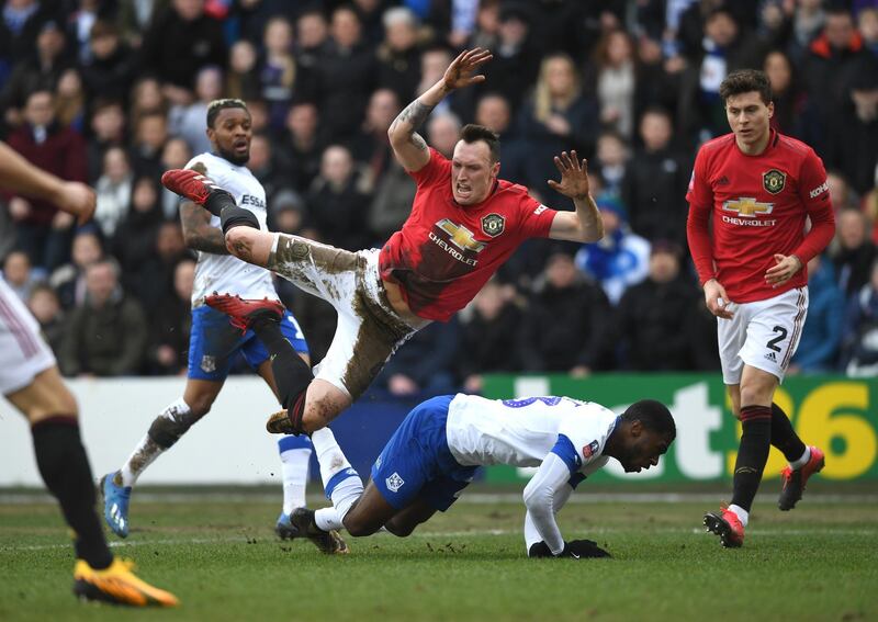 Phil Jones of Manchester United is tackled by Tranmere's Corey Blackett-Taylor. Getty