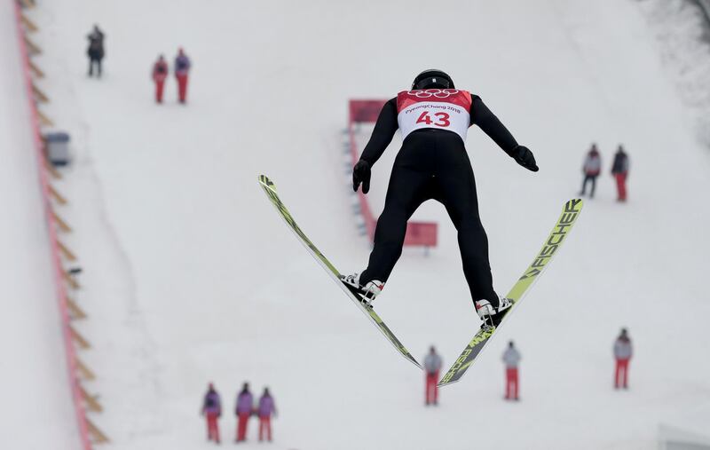Espen Andersen, of Norway, soars through the air during the trial jump in the nordic combined competition at the 2018 Winter Olympics in Pyeongchang. Kirsty Wigglesworth / AP Photo