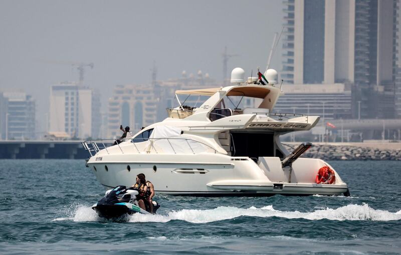 A luxury yacht is pictured off the Dubai Marina Beach in the Gulf emirate, on June 10 2021. Dubai earned a reputation for delivering luxury for those with cash to splash years ago, but amid the Covid-19 pandemic, a new mode of travel has become popular, yachts.
Charter companies said they have seen an increased interest in yachting after coronavirus measures eased, especially among those who want to spend time with friends and family. / AFP / Karim SAHIB
