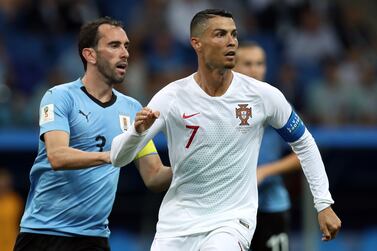 epa06853249 Diego Godin (L) of Uruguay and Cristiano Ronaldo of Portugal in action during the FIFA World Cup 2018 round of 16 soccer match between Uruguay and Portugal in Sochi, Russia, 30 June 2018.

(RESTRICTIONS APPLY: Editorial Use Only, not used in association with any commercial entity - Images must not be used in any form of alert service or push service of any kind including via mobile alert services, downloads to mobile devices or MMS messaging - Images must appear as still images and must not emulate match action video footage - No alteration is made to, and no text or image is superimposed over, any published image which: (a) intentionally obscures or removes a sponsor identification image; or (b) adds or overlays the commercial identification of any third party which is not officially associated with the FIFA World Cup)  EPA-EFE/MOHAMED MESSARA   EDITORIAL USE ONLY