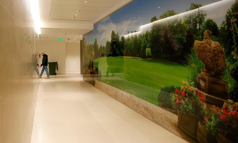 A corridor in the Consular section with a photograph of the Winfield House garden, the official residence of the United States ambassador to the UK, in the new United States Embassy building in central London. Alastair Grant / AFP