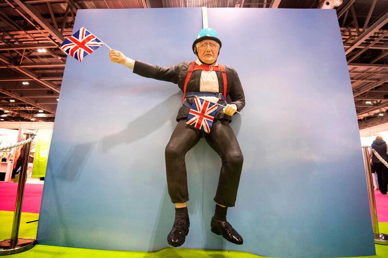 A life-sized cake depicting British Prime Minister Boris Johnson is seen at the Cake and Bake Show at ExCeL in London, Friday, Oct 4, 2019. (Victoria Jones/PA via AP)