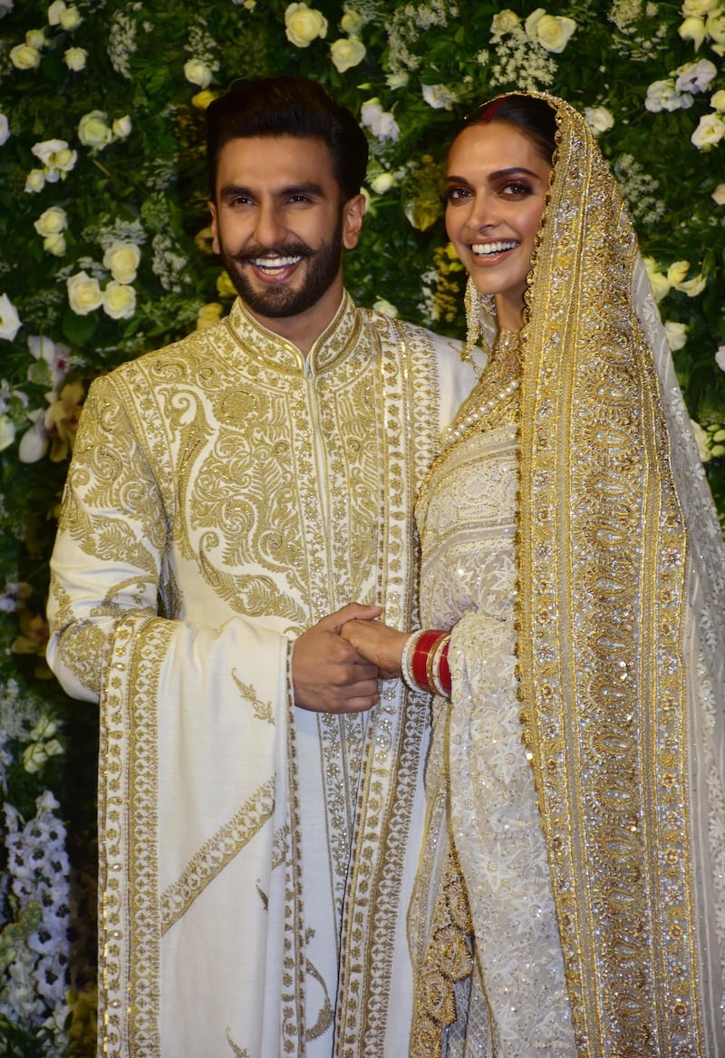 MUMBAI, INDIA - 2018/11/28: Actor Ranveer Singh with wife Deepika Padukone are seen during their wedding reception at the hotel Grand Hyatt in Mumbai. (Photo by Azhar Khan/SOPA Images/LightRocket via Getty Images)