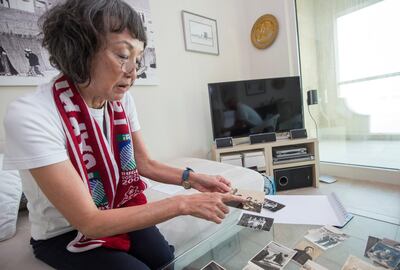 Dubai, United Arab Emirates - Interview with Kimi Makashima, a long-term UAE resident, who is fourth-generation rugby-player/follower from Japan showing old photos of rugby games at her apartment.  Leslie Pableo for The National for Paul Radley's story