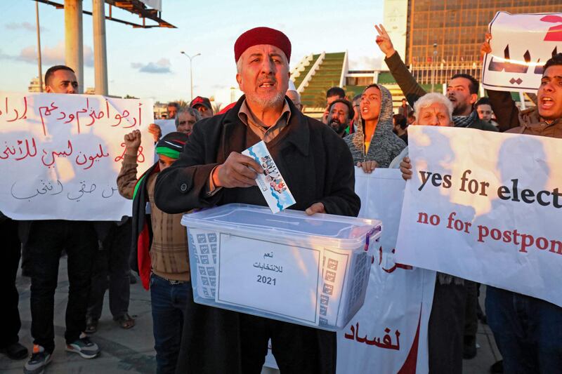 Libyans demonstrate against the postponement of elections, in the city of Benghazi. AFP