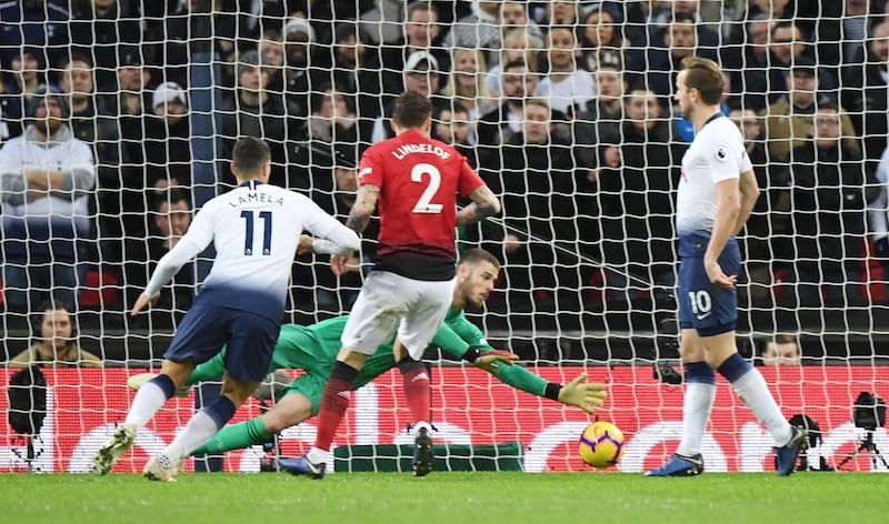 De Gea dives to keep the ball out against Tottenham Hotspur. EPA