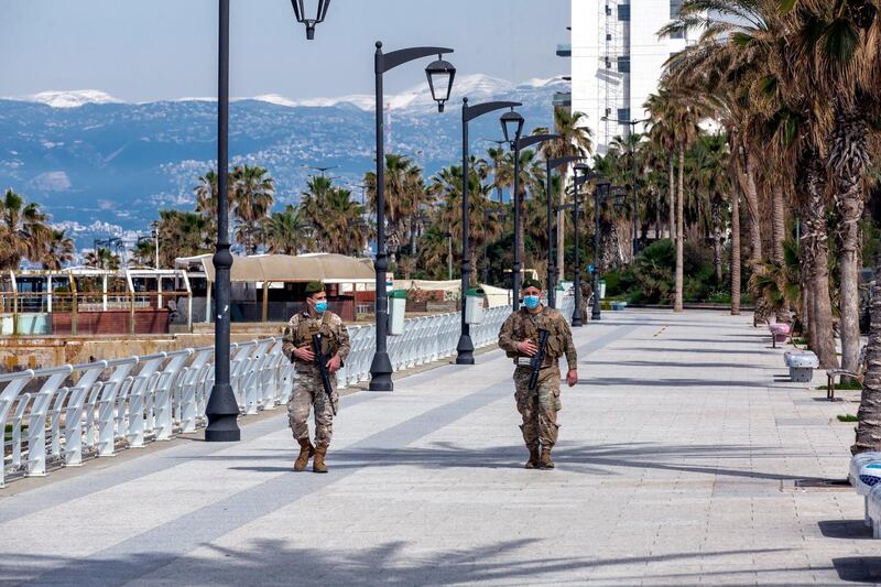 Lebanese soldiers patrol at a seaside area during curfew lockdown in Beirut. EPA