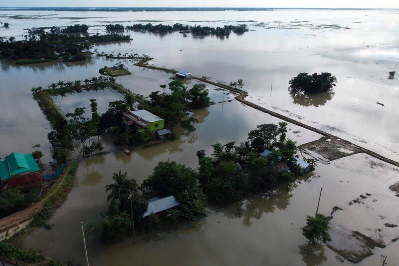 In this aerial photo inundated houses are seen in Sunamgong on July 14, 2020.AFP