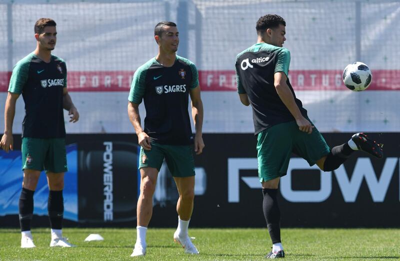 From right: Portugal's Pepe, Cristiano Ronaldo and Andre Silva during training in Kratovo, Moscow on June 17, 2018. Francisco Leong / AFP