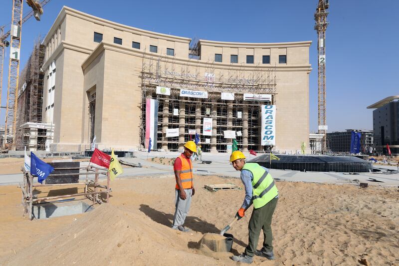 Workers at a construction site of the Central Bank of Egypt at the New Administrative Capital (NAC), 45km east of Cairo. EPA