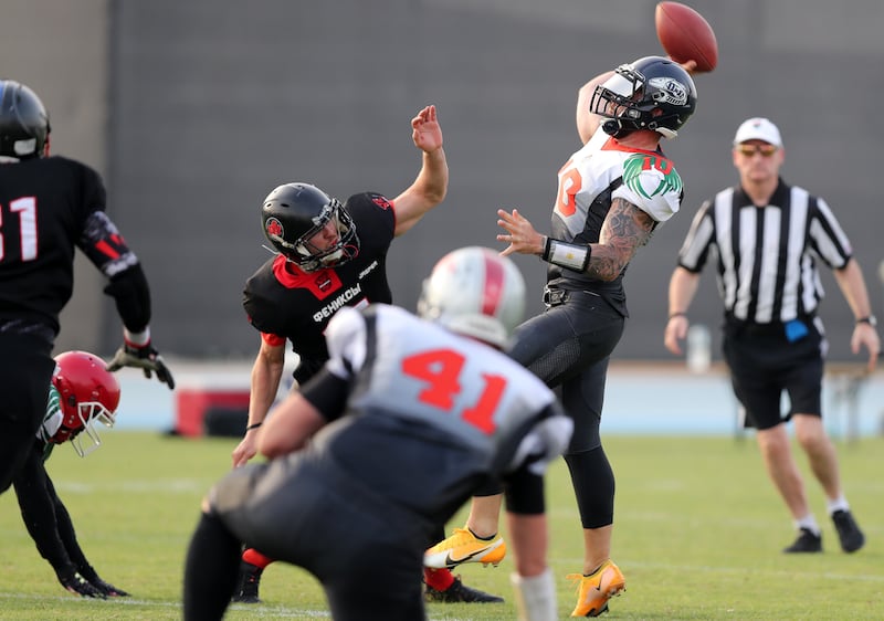 Eagles' quarterback Jake Shoup throws the ball. 