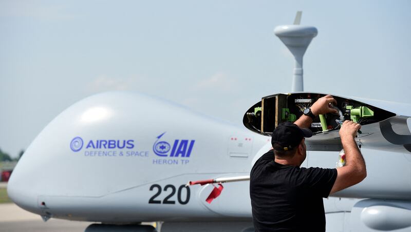 A man working on an Israeli-made Heron TP drone near Berlin. AFP