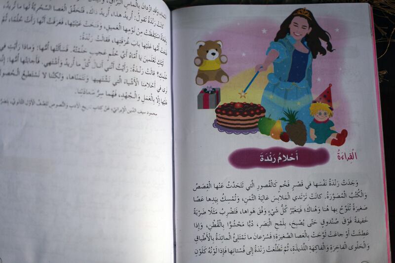 One of the new textbooks features a picture of a woman without head covering. Salah Malkawi for The National
