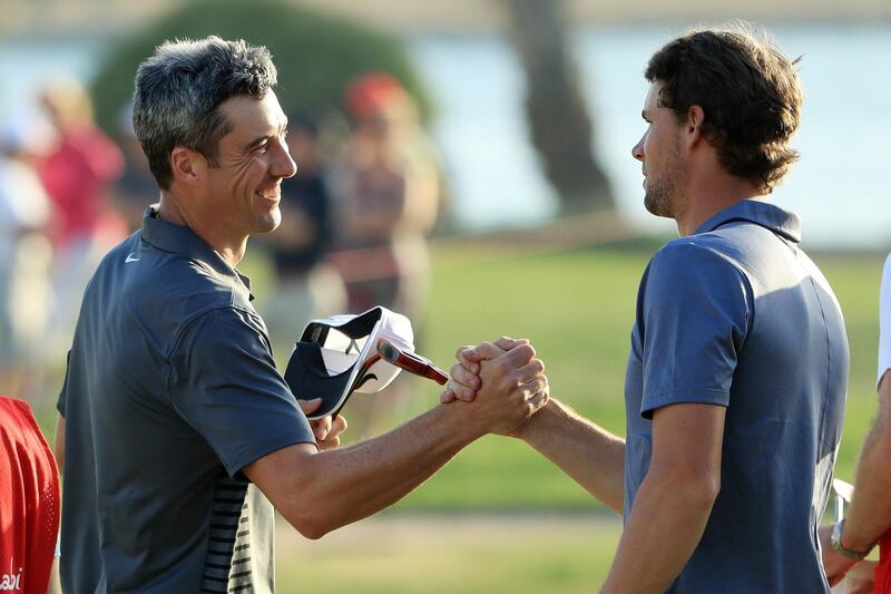 ABU DHABI, UNITED ARAB EMIRATES - JANUARY 20:  Ross Fisher of England and Thomas Pieters of Belgium shake hands on the 18th green after finishing during round three of the Abu Dhabi HSBC Golf Championship at Abu Dhabi Golf Club on January 20, 2018 in Abu Dhabi, United Arab Emirates.  (Photo by Andrew Redington/Getty Images)