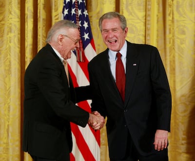 FILE PHOTO - U.S. President George W. Bush (R) shares a light moment with comic book creator Stan Lee as Lee is presented with a National Medal of Arts during a ceremony at the White House in Washington, November 17, 2008.  REUTERS/Jason Reed/File Photo