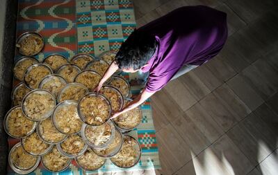 A volunteer prepares an Iftar meal for at a mosque in Adliya, Bahrain. Reuters