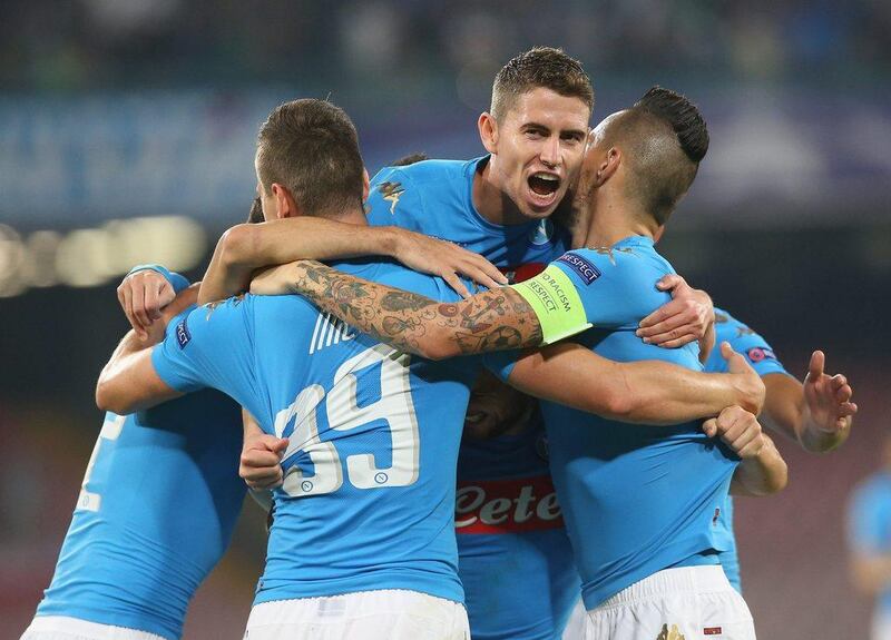 Napoli players celebrate during their Champions League win over Benfica on Wednesday night. Maurizio Lagana / Getty Images