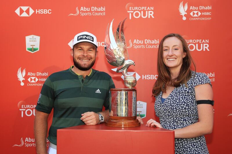 Tyrrell Hatton celebrates with girlfriend Emily Braisher following victory at the Abu Dhabi HSBC Championship. Getty