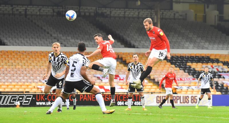 Salford's James Wilson heads at goal against Port Vale. Getty