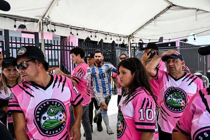 Fans of Lionel Messi wait for his arrival at the DRV PNK Stadium in Fort Lauderdale, Florida, ahead of his arrival to sign for Inter Miami.  AFP