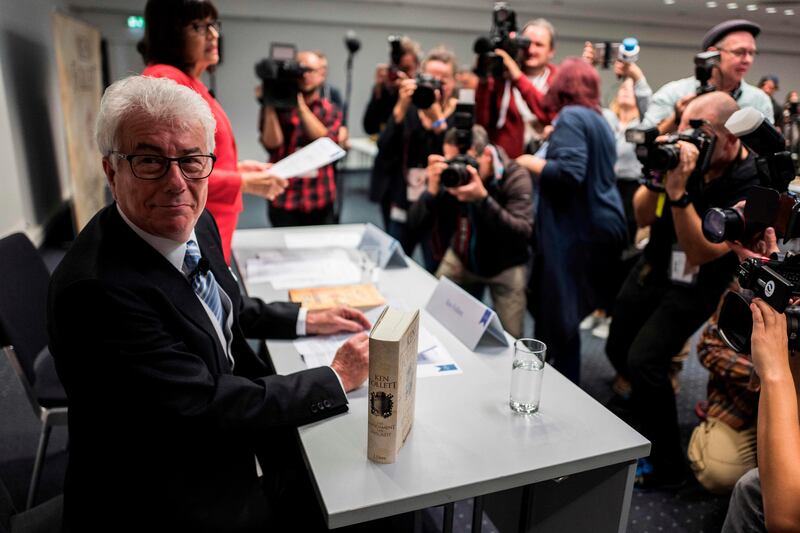 British author Ken Follett takes his seat prior to a press conference at the Frankfurt Book Fair 2017 in Frankfurt am Main, central Germany, on October 11, 2017
The Frankfurt book fair is the world's largest publishing event, bringing together over 7,000 exhibitors from more than 100 countries.  / AFP PHOTO / John MACDOUGALL