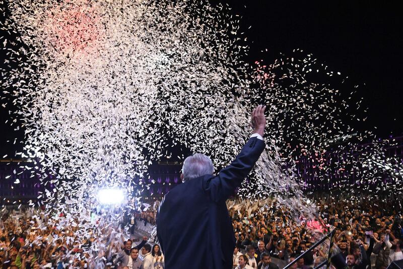 Newly elected Mexico's President Andres Manuel Lopez Obrador, running for "Juntos haremos historia" party, cheers his supporters at the Zocalo Square after winning general elections, in Mexico City, on July 1, 2018. Alfredo Estrella /AFP