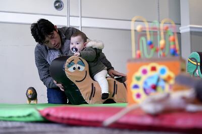 Afghan refugees in a playroom in a hotel in Leeds. PA