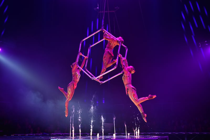 The air cube show has three aerial acrobats who perform mid-air.