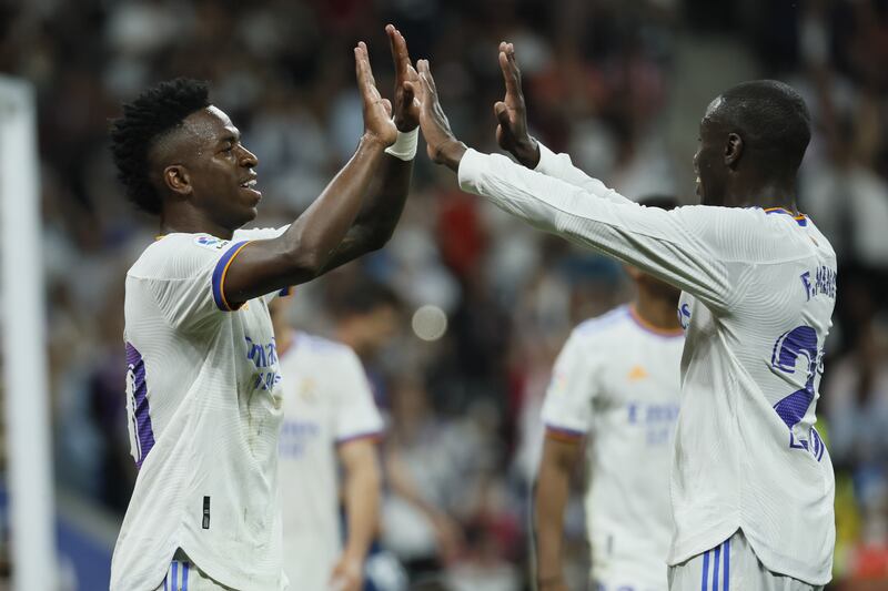 Vinicius Junior celebrates with teammate Ferland Mendy. EPA