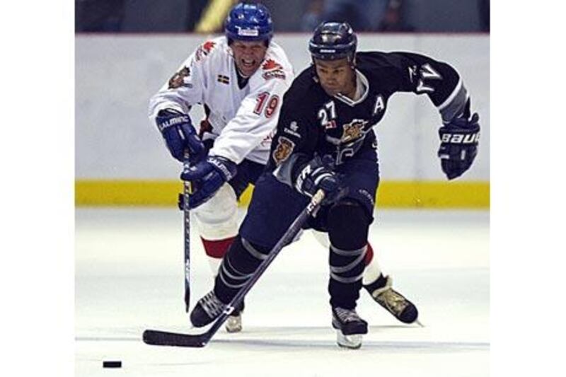 The International All-Star player Willy Lindstrom chases the Dubai Mighty Camels' Jaime Nelson during a match in Dubai.