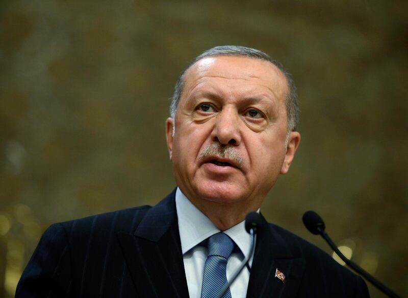 Turkey's President Recep Tayyip Erdogan speaks during a meeting in Ankara, Turkey, Tuesday, April 30, 2019. Erdogan said a U.S. F-35 fighter aircraft program that excludes Turkey would be " doomed to a total collapse." Erdogan made the comments at the fair amid warnings from Washington that Turkey's decision to purchase the Russian S-400 missile systems will jeopardize Turkey's participation in the F-35 program.(Presidential Press Service via AP, Pool)