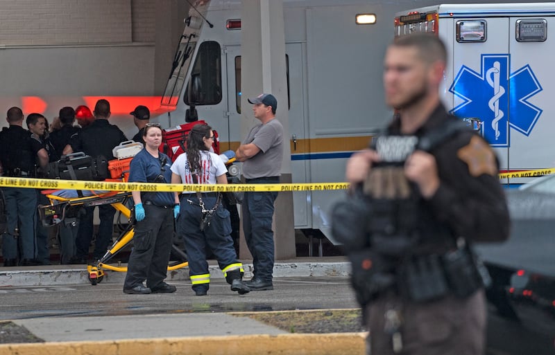 Emergency personnel gather after a deadly shooting at a mall in Greenwood, a town near Indianapolis. AP