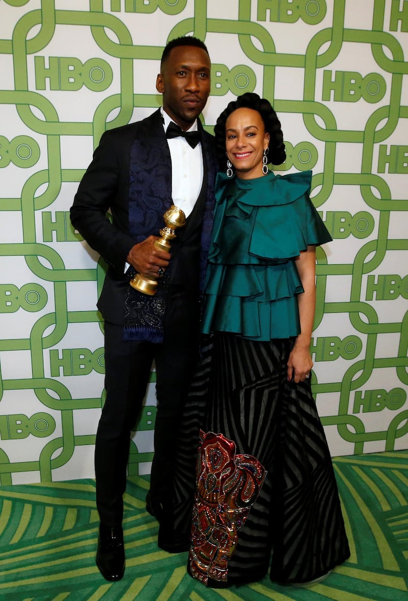 Mahershala Ali, winner of Best Supporting Actor, Motion Picture, and his wife Amatus Sami-Karim. REUTERS